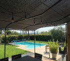 Toile d'ombrage pergola 6x3 m perméable avec œillets à poser sur une structure